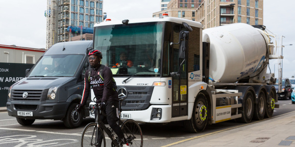 HGV with good direct vision stopped at junction with cyclist