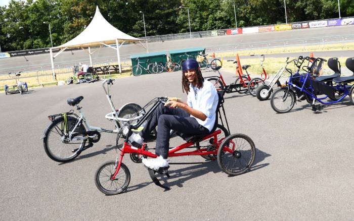 TfL Youth Panel member riding a tricycle